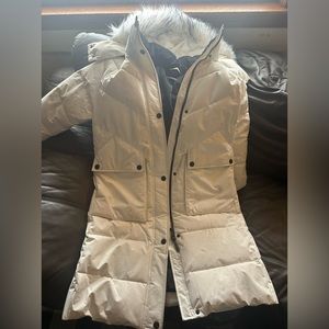 DKNY white long winter jacket with button down sides and zip up jacket..fur hood